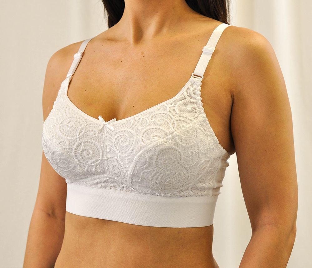 a woman is wearing a white lace bra