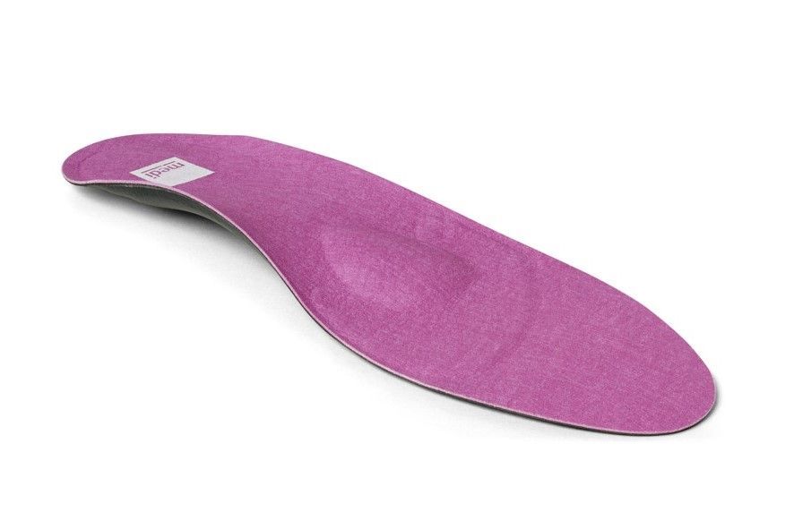 a purple insole is sitting on a white surface .