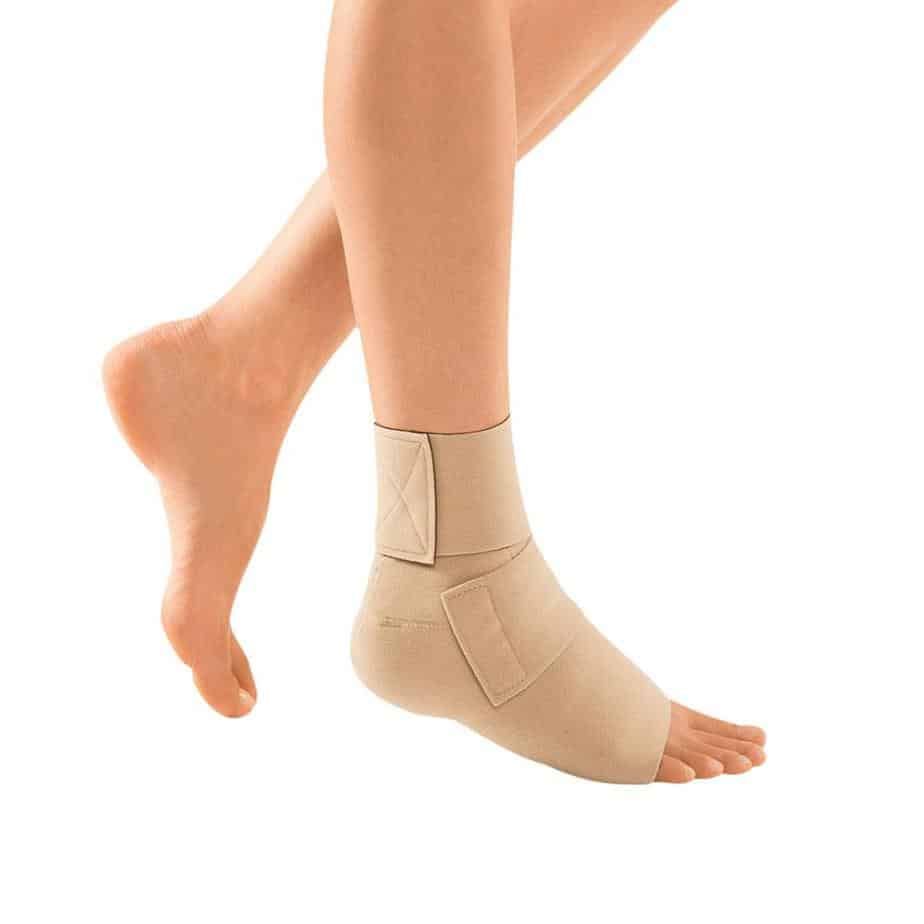 a woman is wearing an ankle brace on her foot