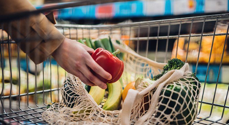 Person Buying Healthy Foods — Acworth, GA — Elite Total Wellness