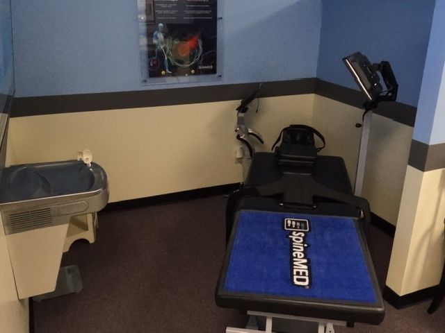 A room with a table that says spinemed on it