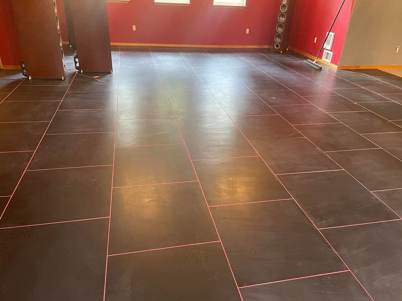 A room with a tiled floor and red walls.