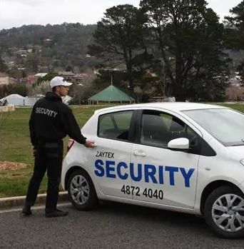 Man Opens The Car Door Of Zaytex Security Mobile Patrol — Mobile Patrols in Southern Highlands, NSW