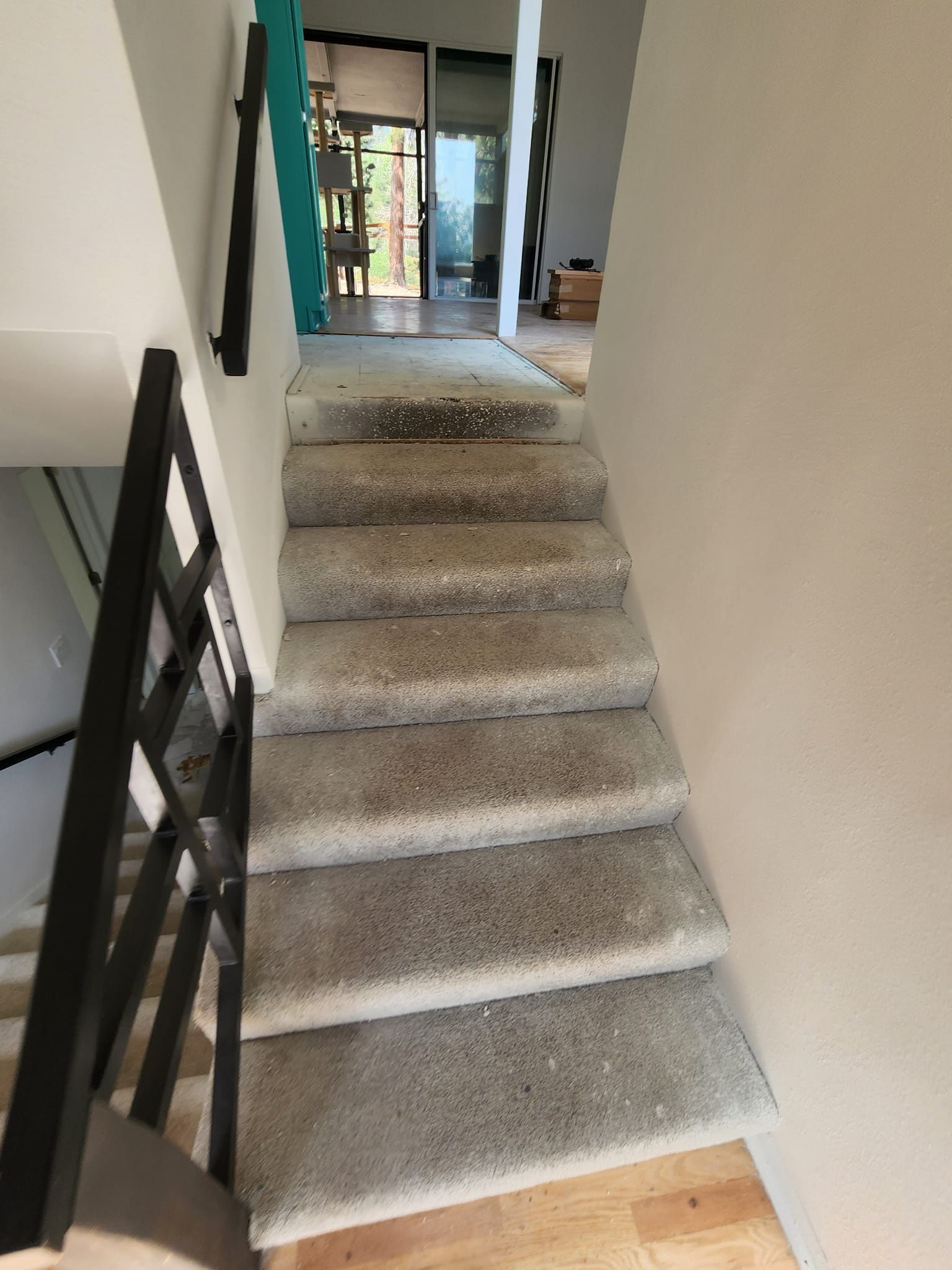 A set of stairs leading up to the second floor of a house.
