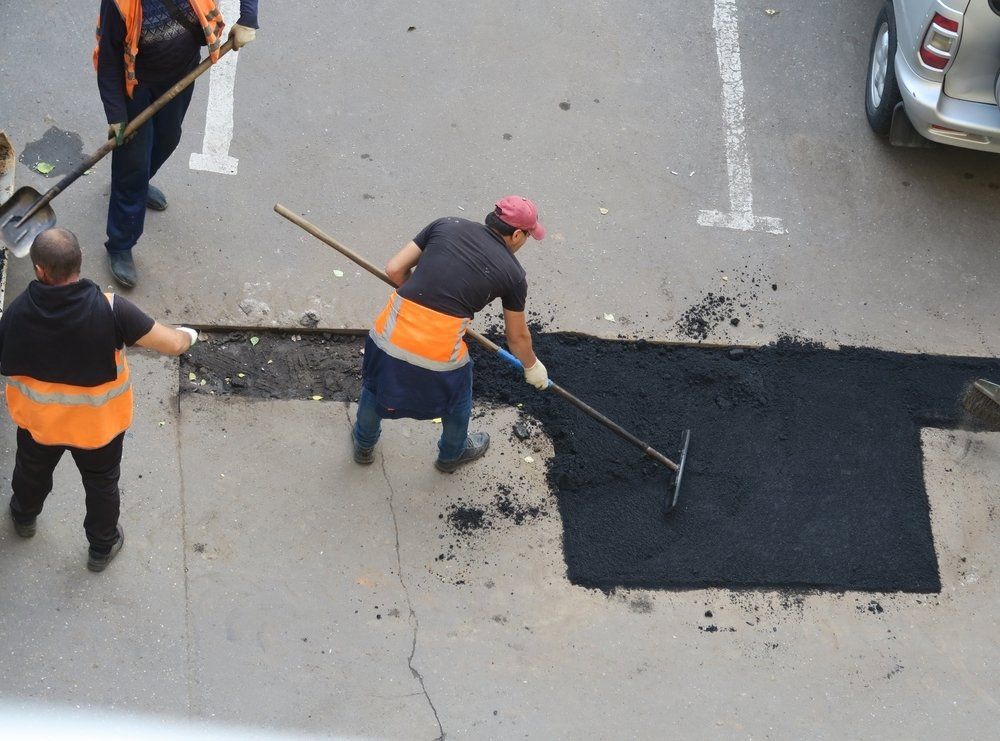 Laying New Asphalt Pavement On The Carpark — Bitumen Services in Darwin, NT