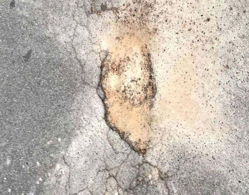 Pothole In Need Of Repair — Bitumen Services in Darwin, NT