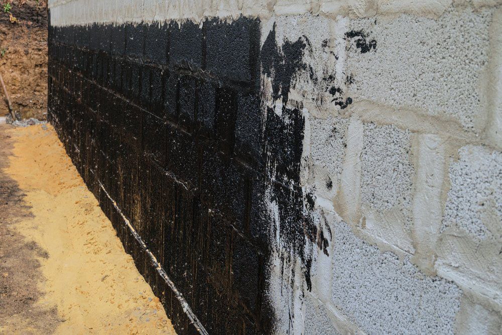 Protective Waterproofing Coating Of Walls In Contact With The Ground That Has Bitumen Mastic — Bitumen Services in Darwin, NT