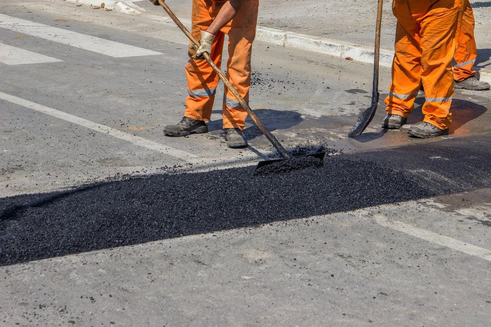 Putting Speed Humps On The Road For Slowing Traffic — Bitumen Services in Darwin, NT