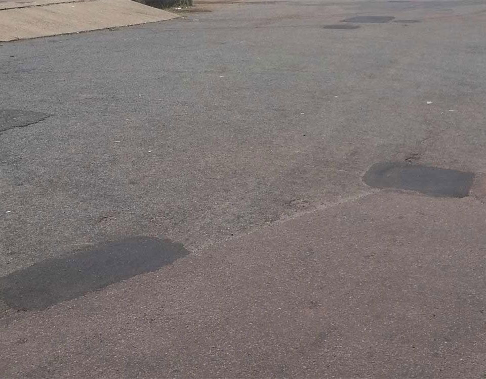 Yard With Pot Holes Repaired — Bitumen Services in Darwin, NT