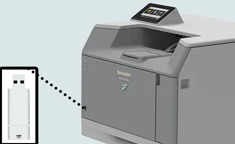 A Sharp printer with a USB stick next to it, highlighting the printer's USB port for document transfer.