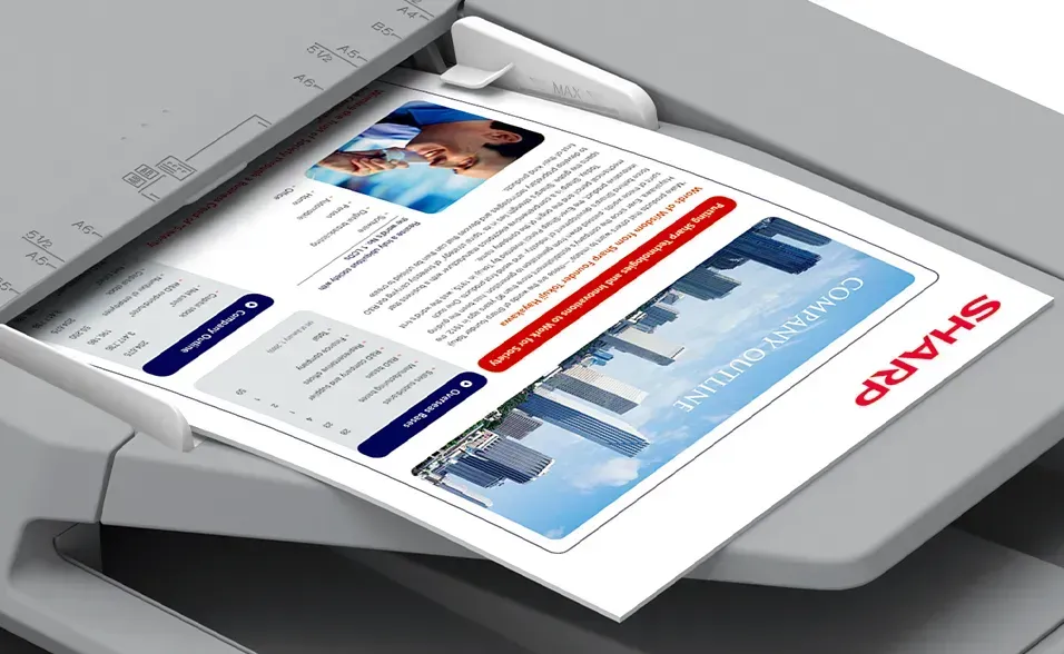 A document is being scanned on a Sharp copier.