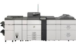 Large, industrial printer, white and gray, with multiple paper trays, and a control panel.