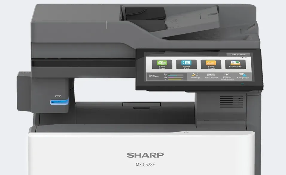 A Sharp MX-C306W multifunction printer with a touch screen, white base, and gray upper section.