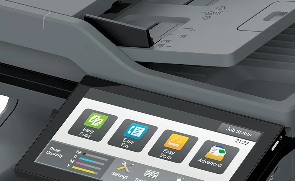 Close-up of a multifunction printer control panel with a touchscreen displaying scan and copy options.