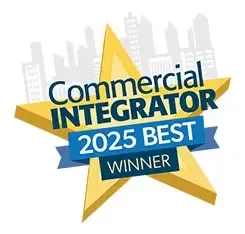 Commercial Integrator 2025 Best Winner award badge with a gold star, blue banner, and city skyline.