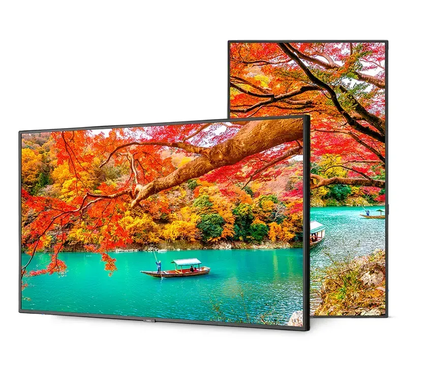 Two rectangular TVs showing vibrant autumn landscape: turquoise water, colorful trees, and a boat.
