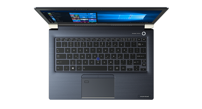 Top-down view of a dark blue Toshiba laptop with a keyboard, touchpad, and opened screen displaying a Windows interface.