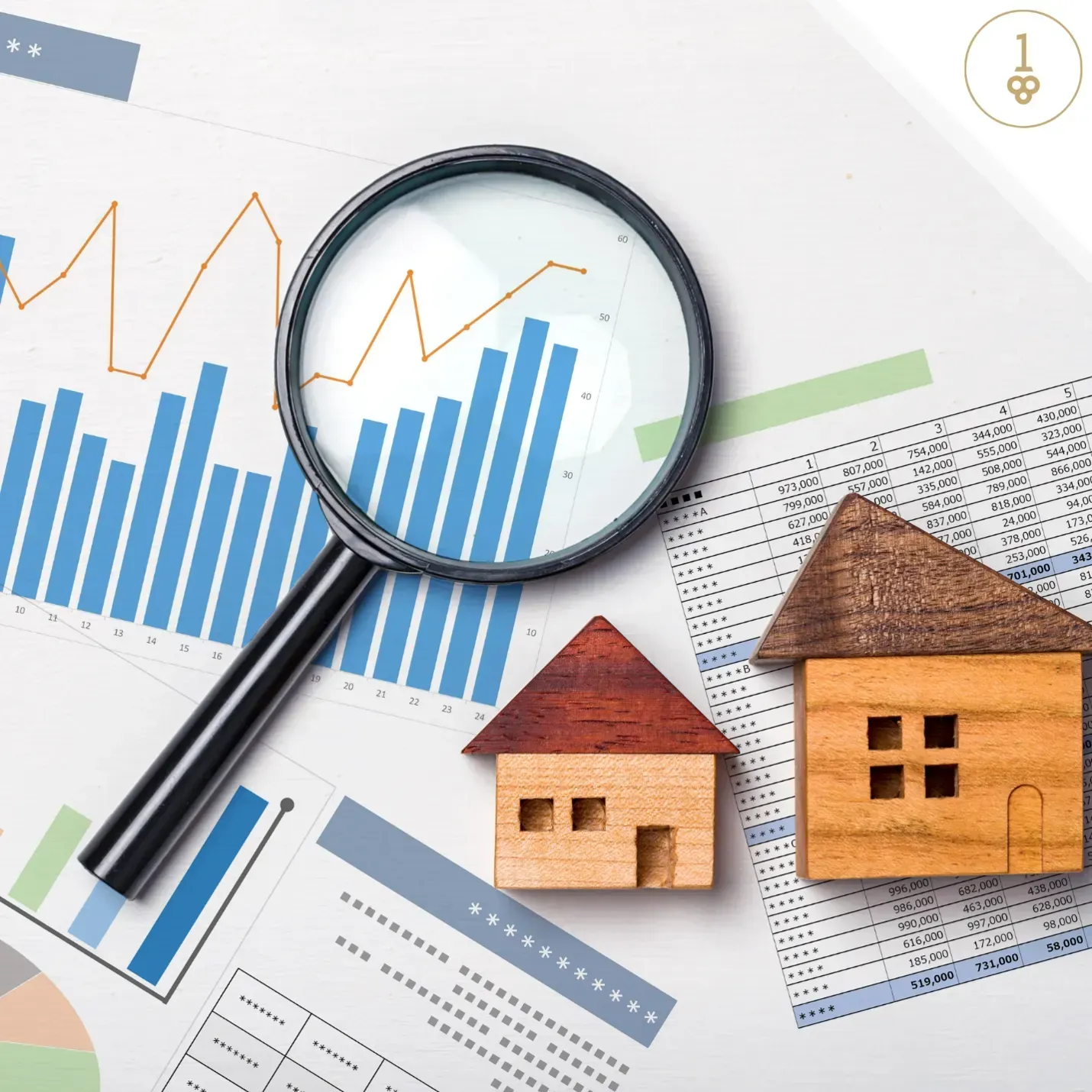 A magnifying glass is sitting on top of a graph next to two small houses.