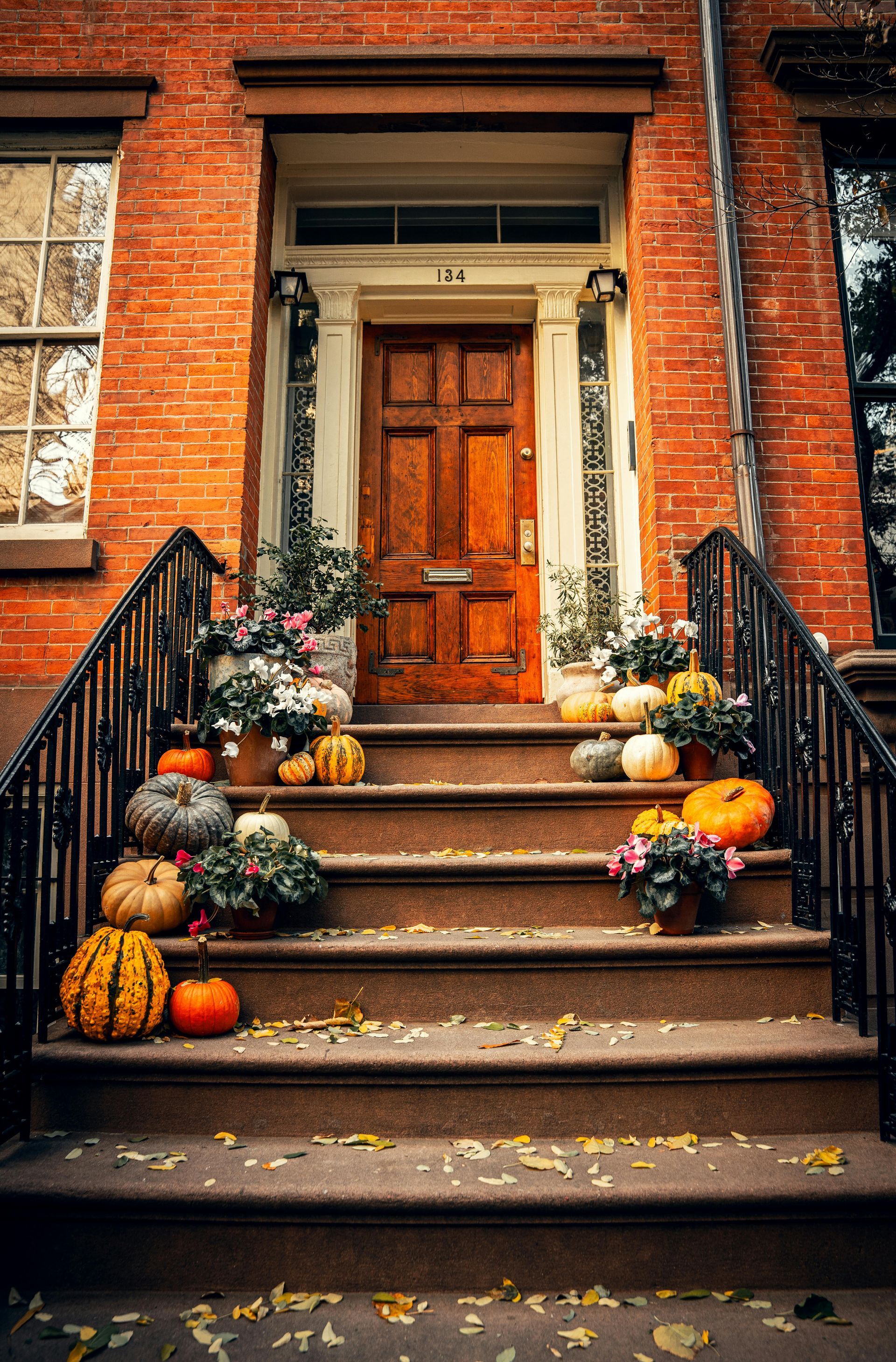 steps to townhouse with fall decorations