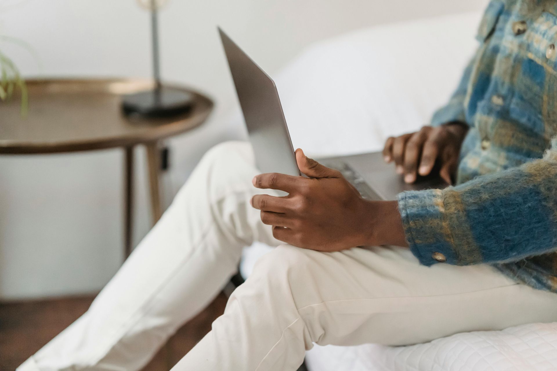 hands searching on a laptop
