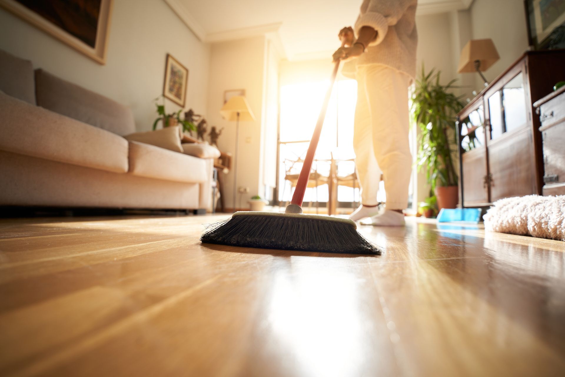 Woman Sweeping The Parquet Floor — West Palm Beach, FL — Maid Golden LLC