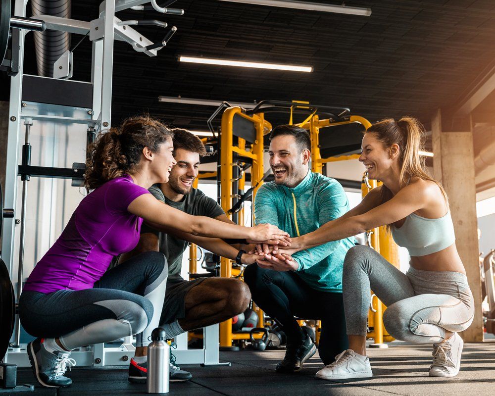 Group Fitness — Group of People Joining Hands in South Zanesville, OH