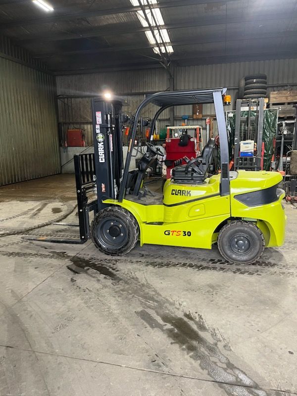 Two Men Are Working on a Forklift in a Garage | Shepperton, VIC | L&P Mackin Forklifts