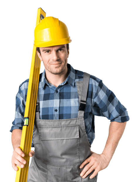 A man wearing a hard hat and overalls is holding a level.