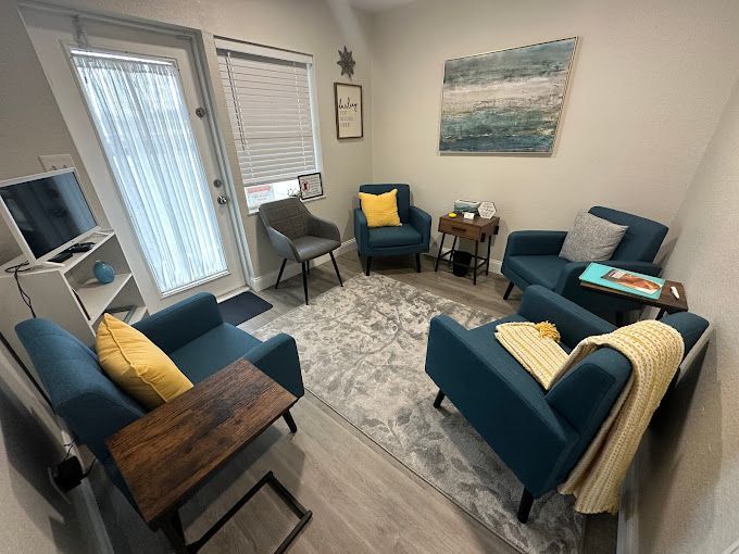 A living room filled with furniture and a television.