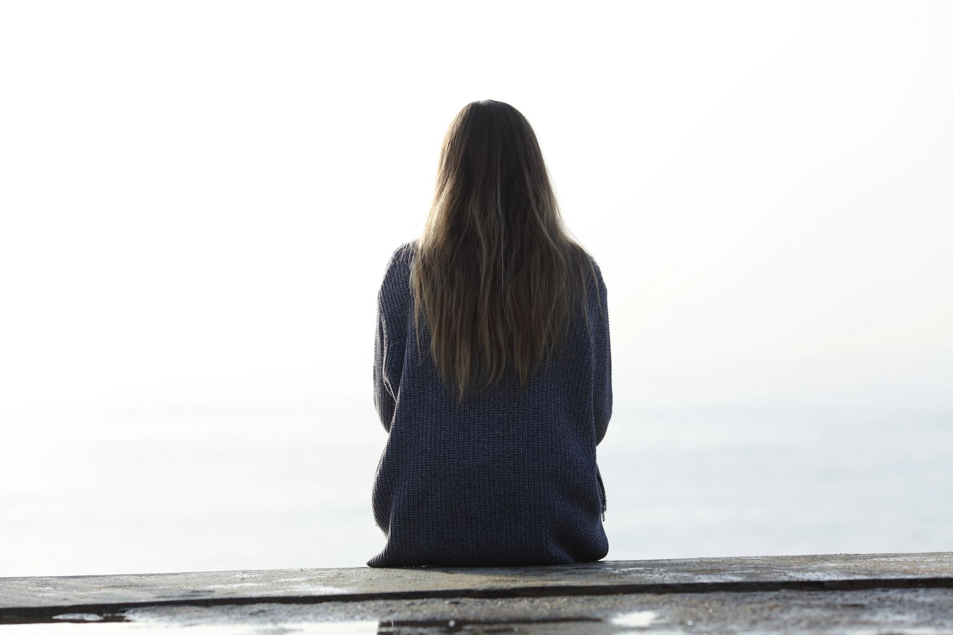 Woman sitting with her back to the camera 