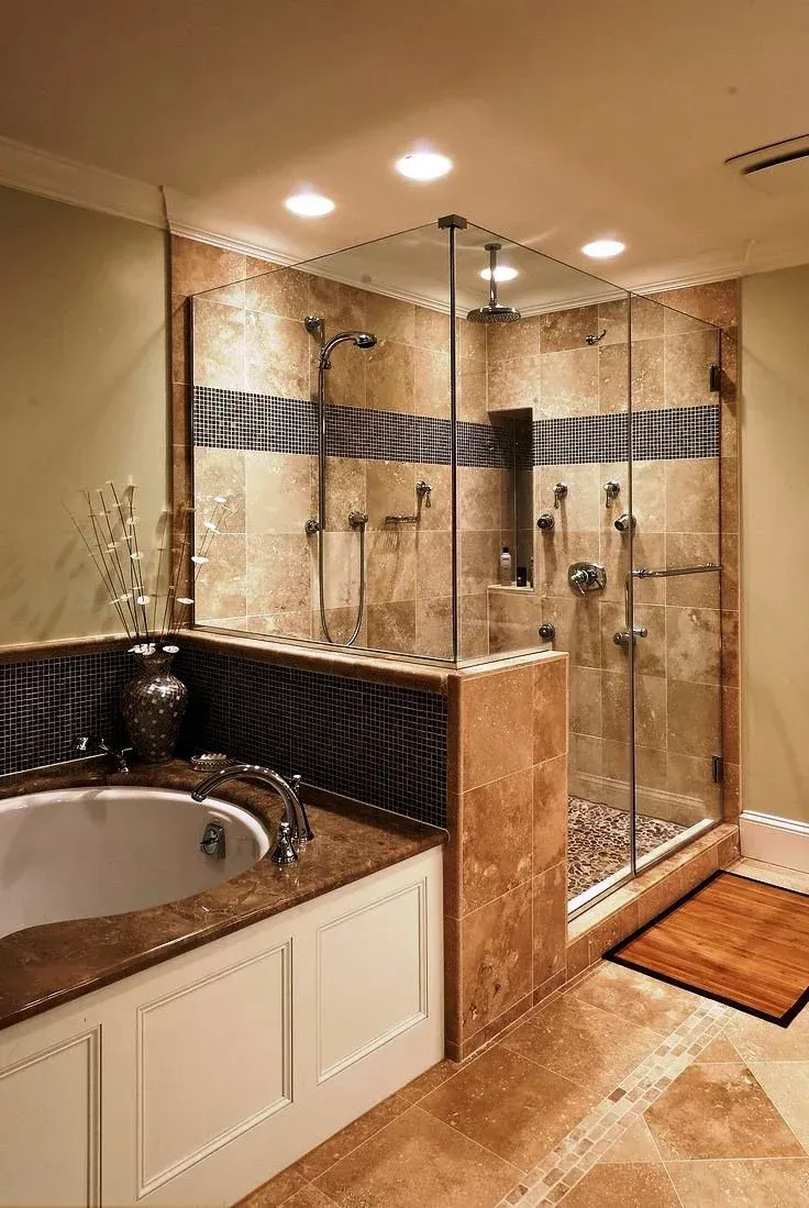 A man is standing on a ladder in a bathroom.