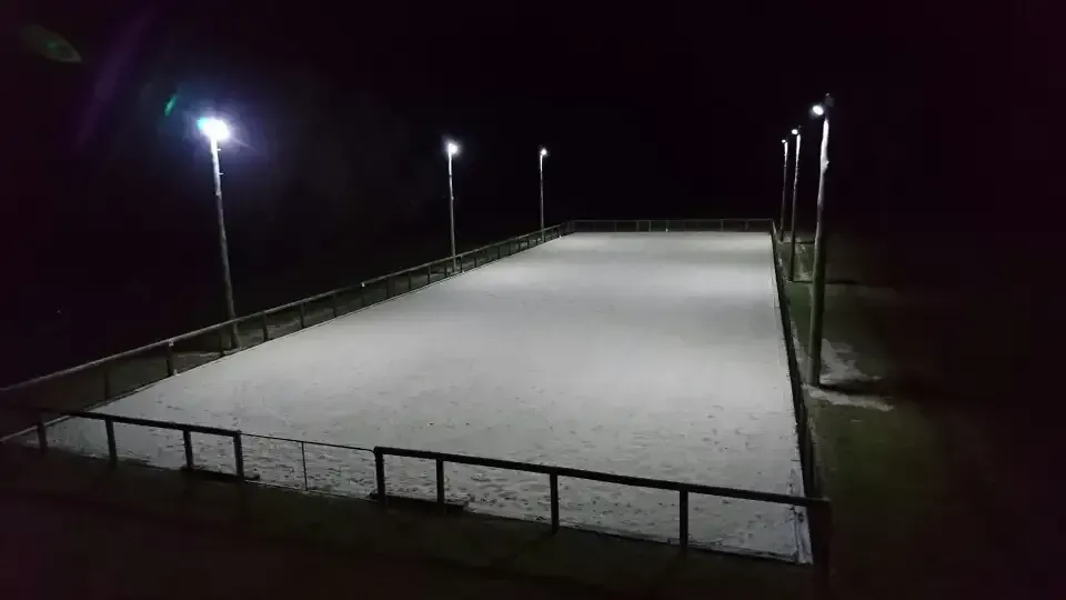 Lighted Equestrian Arena at Night, With Sand Footing and Surrounding Fence — Jade Fluerty Electrical In Tinana, QLD