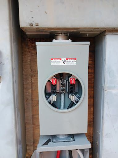 A close up of an electrical box on a wall.