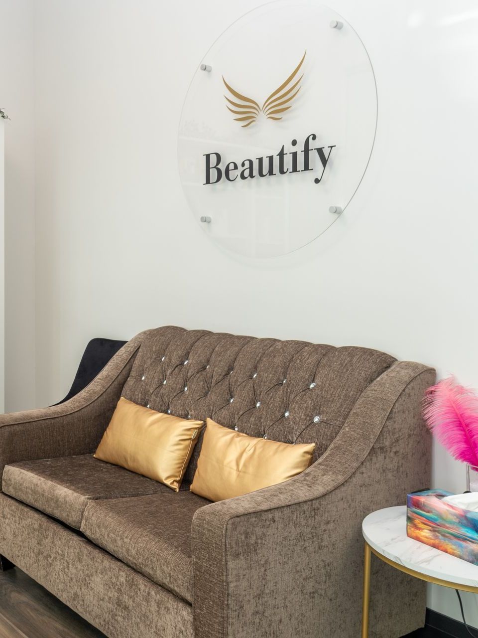a couch in a room with a sign that says beautify