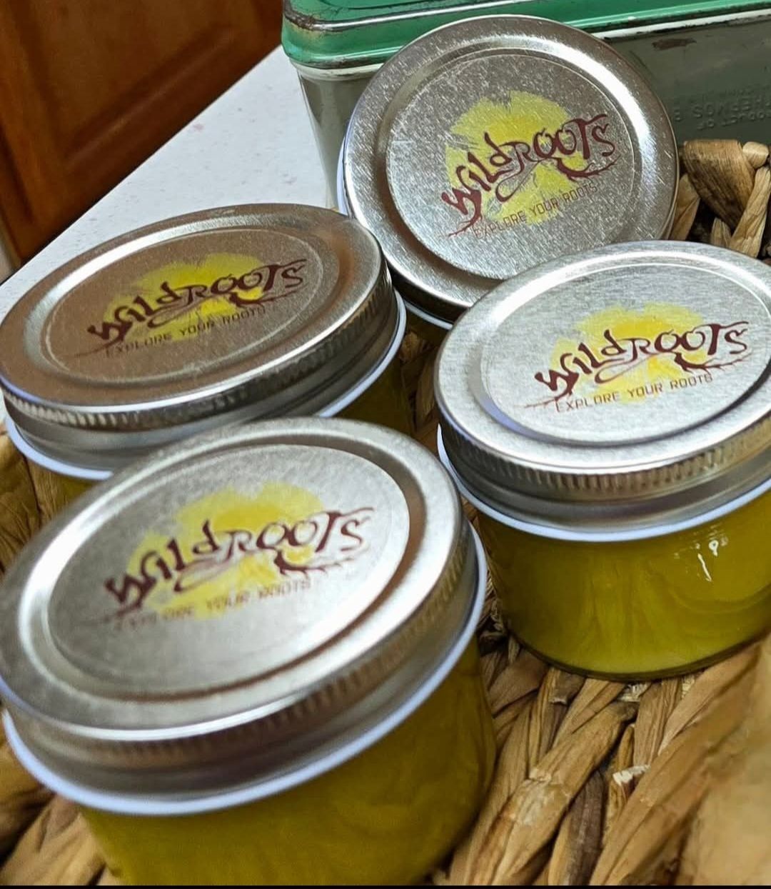 Four jars of yellow balm with