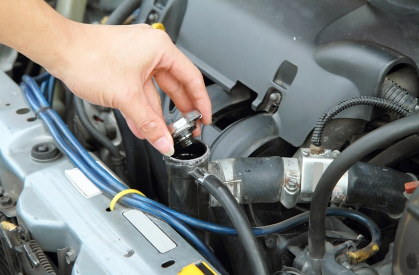 A close up of a brake disc and brake caliper on a car.