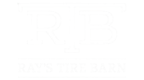 A black and white logo for ray 's tire barn.