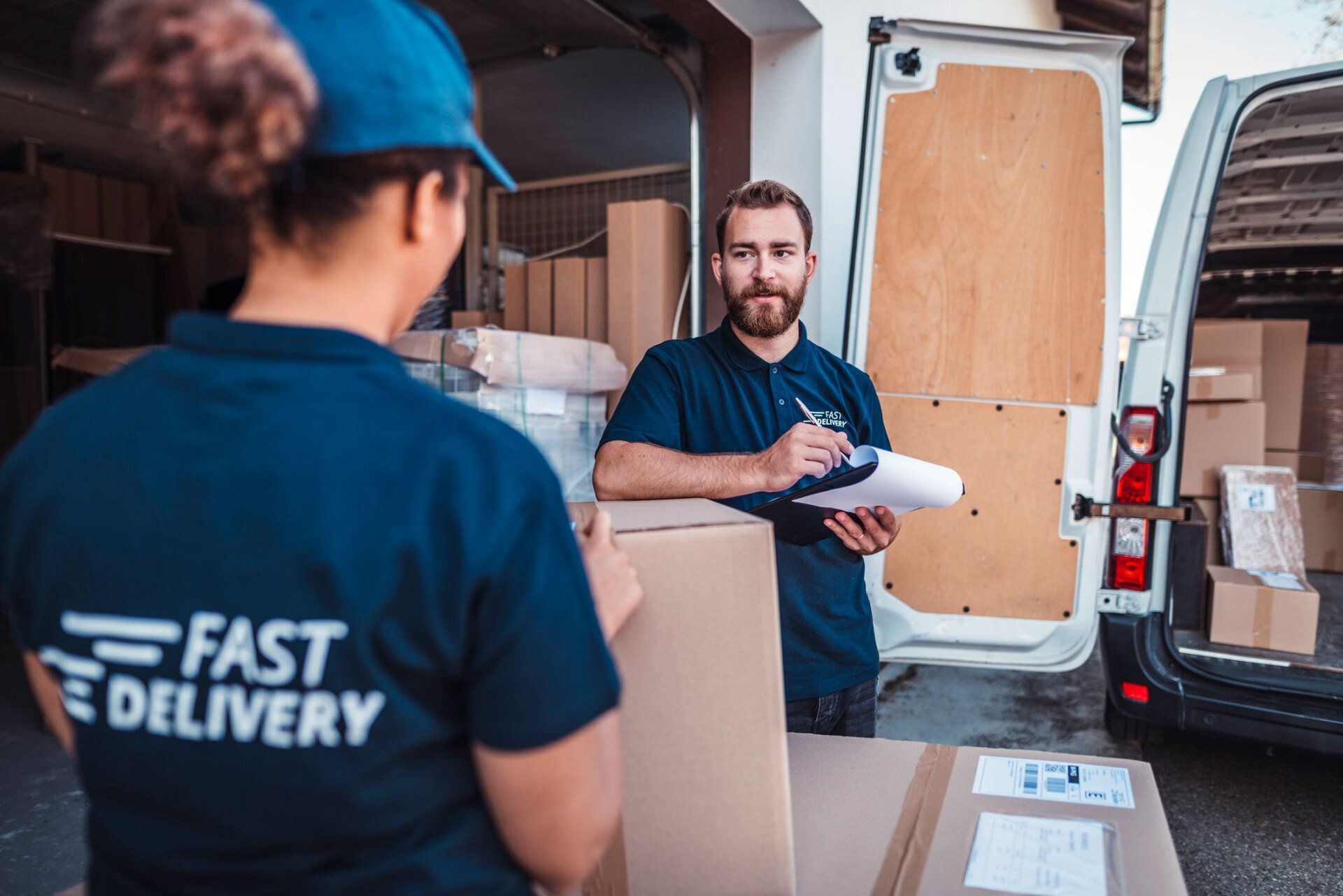 Two Movers Discussing To Each Other – Virginia Beach, VA – A Friendly & Affordable Mover