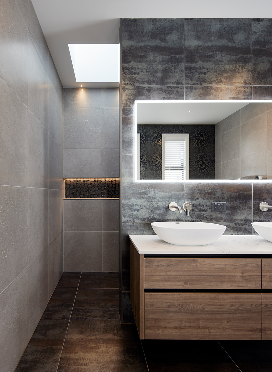 A bathroom with two sinks and a mirror. Auckland Tilers