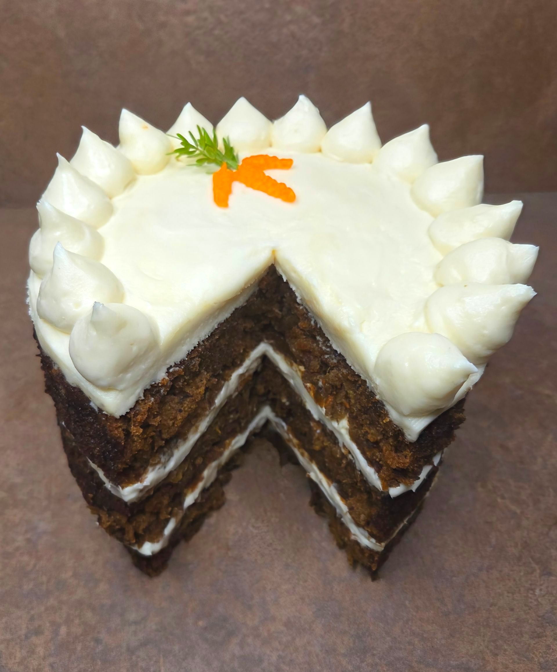 Chez Panise Carrot Cake with a slice taken out