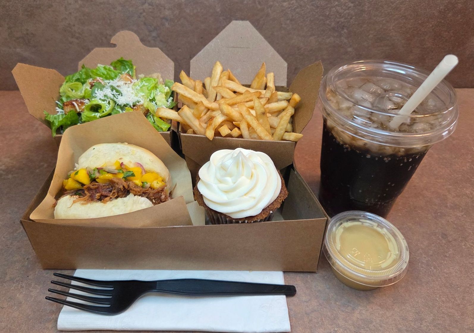 Chez Panise Number 2 Combo with a Slider, fries, salad, cupcake, salad dressing, and drink