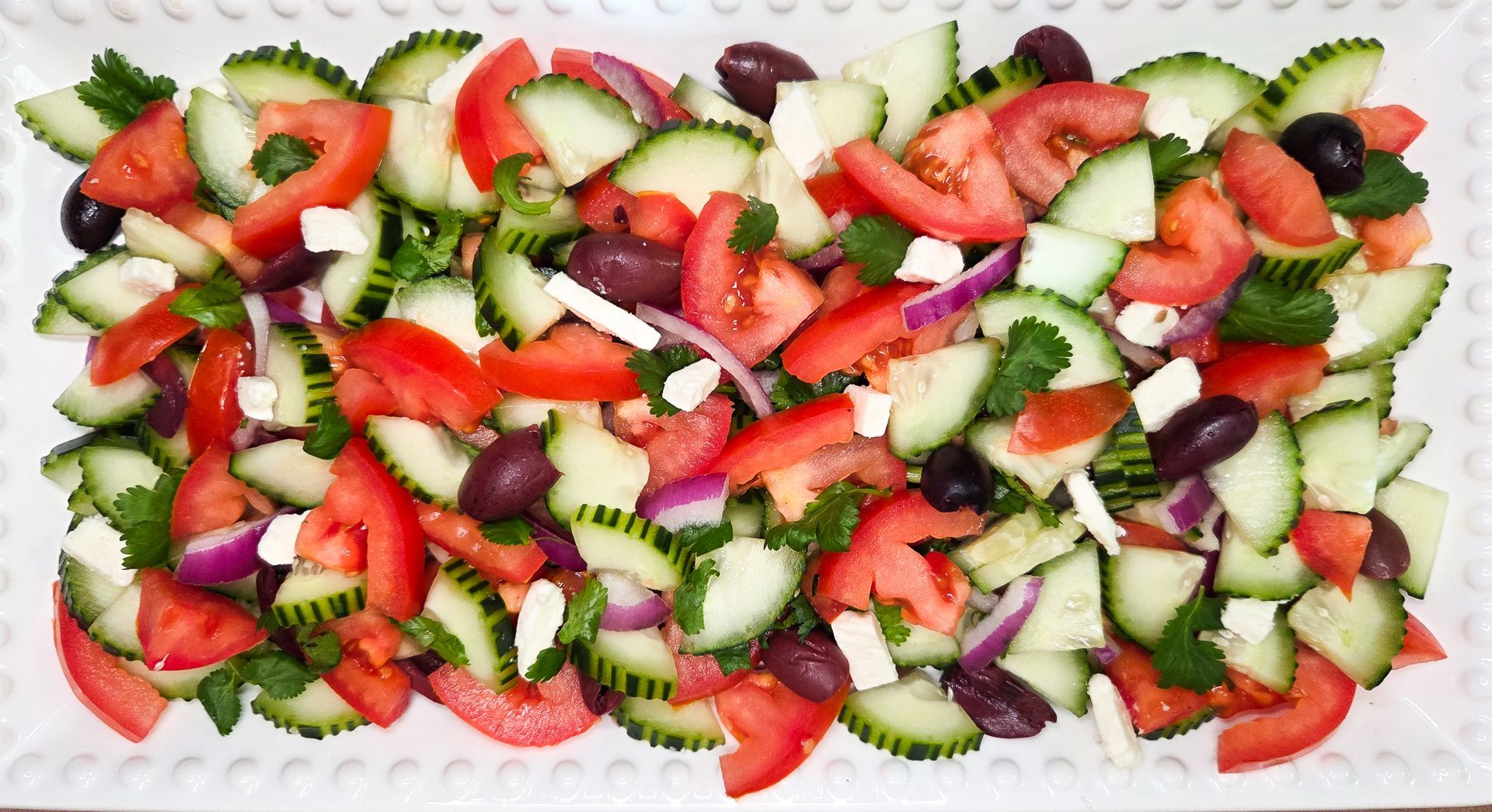 Chez Panise Greek Salad on a white rectangular plate