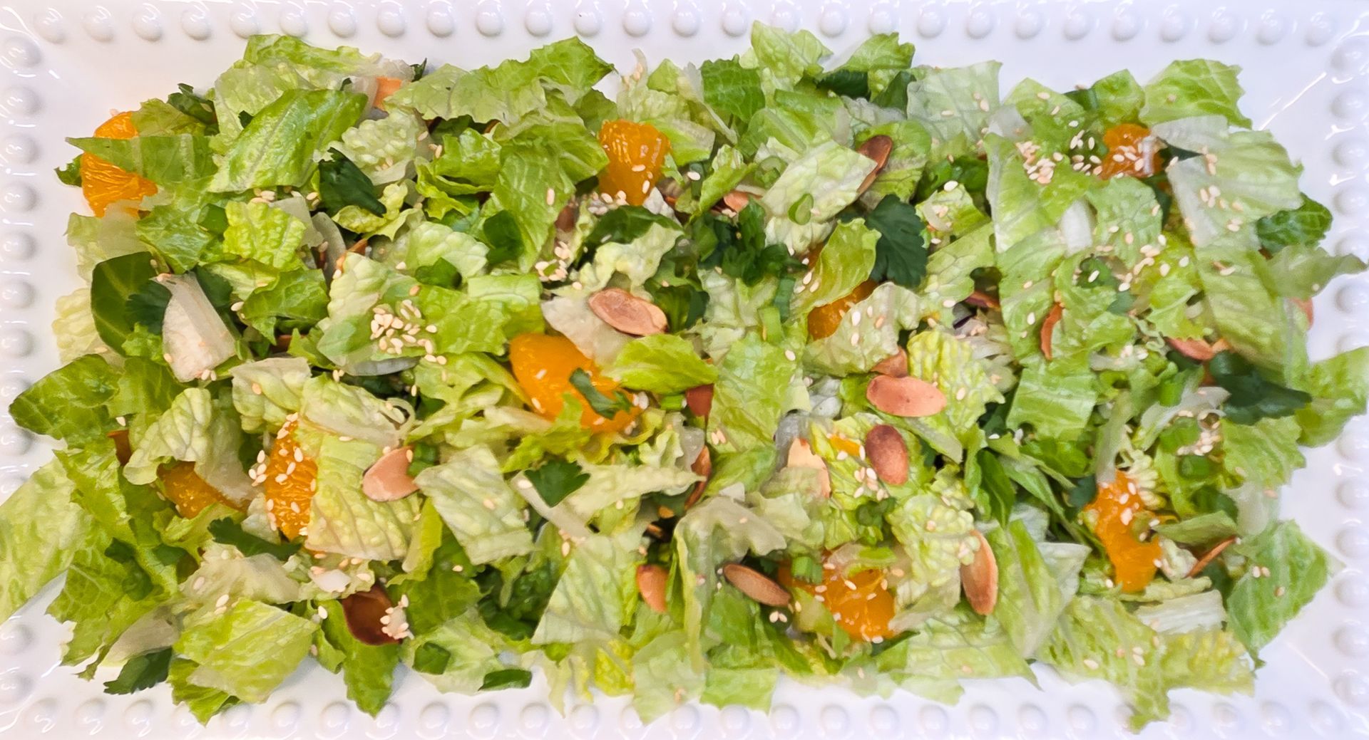 Chez Panise Asian Salad on a white rectangular plate