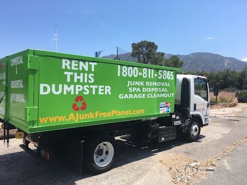 Green dumpster truck, 