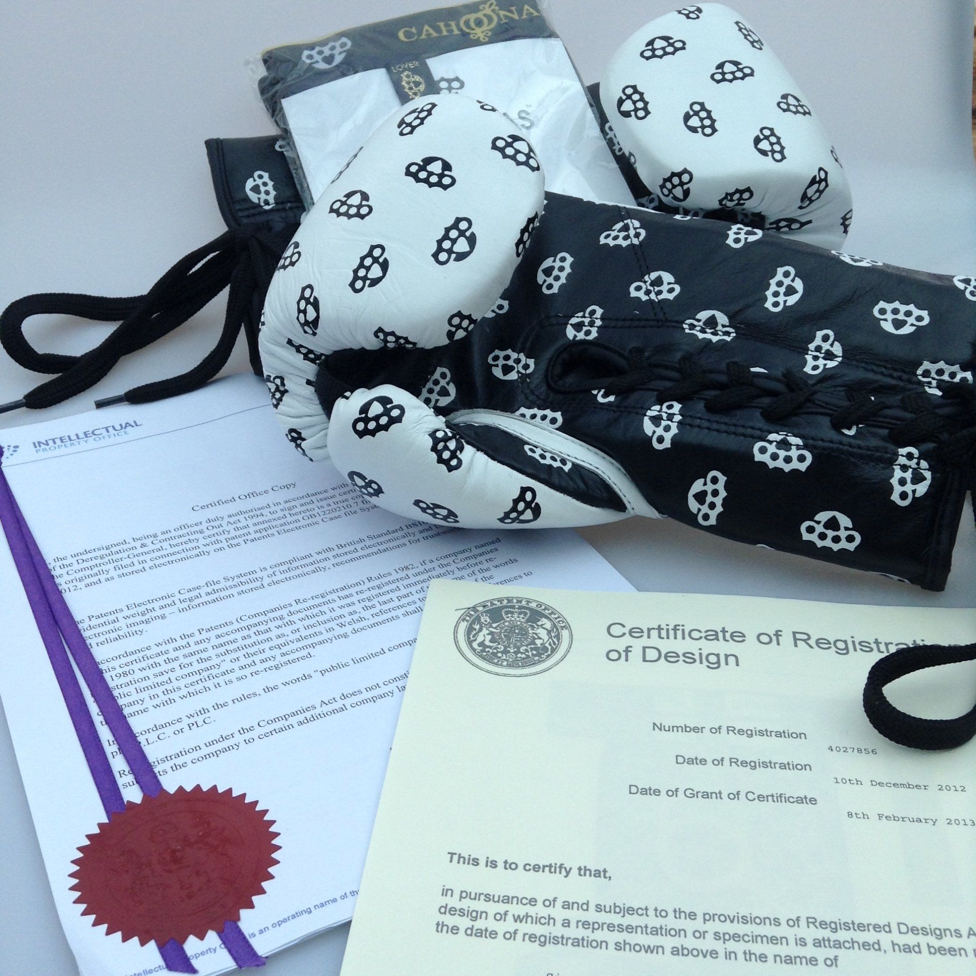 World first, image shows patented British luxury underwear with certificate and boxing gloves with other intellectual property certificates.