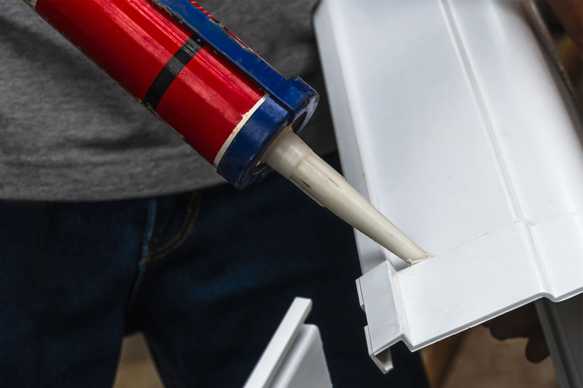 Putting Sealant on Gutter