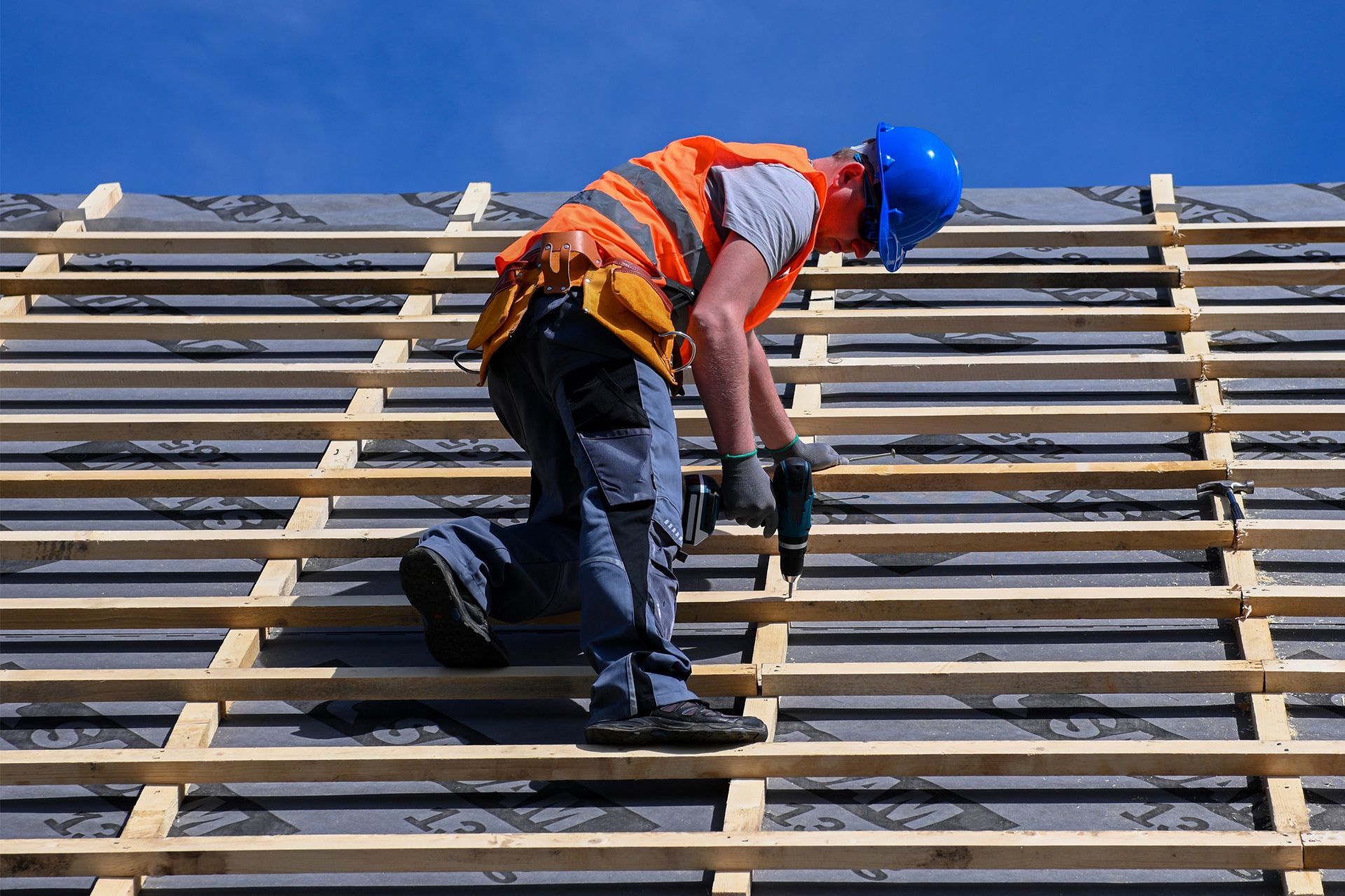 Construction Worker Working on the Roof of a Building