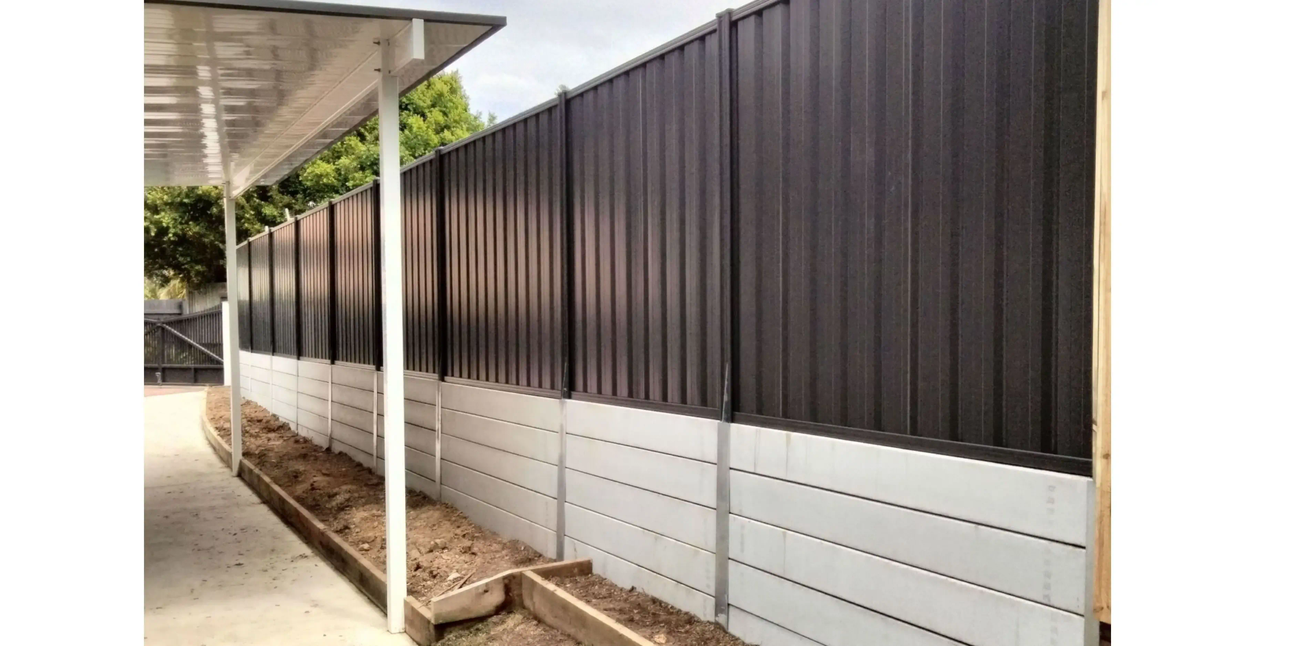 A Metal Fence Next to a Carport — Tuff Fencing in Caboolture, QLD