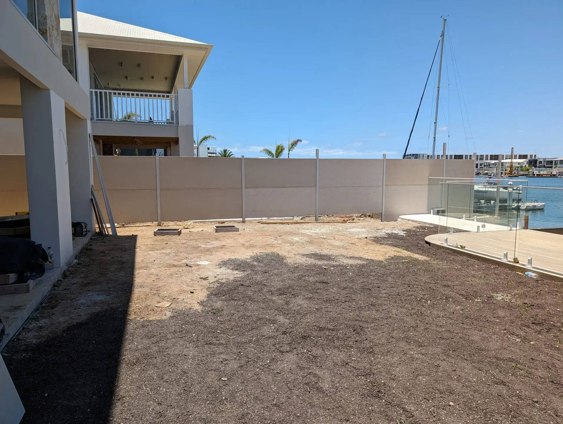 A Glass Fence on Canal in Backyard — Tuff Fencing in Caboolture, QLD