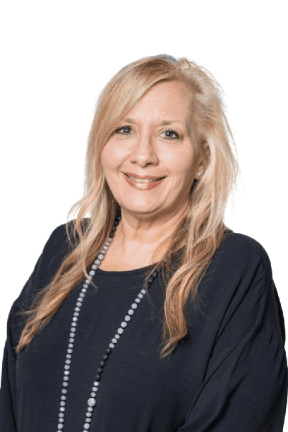 Smiling woman with long blonde hair in a navy top and beaded necklace against a white background